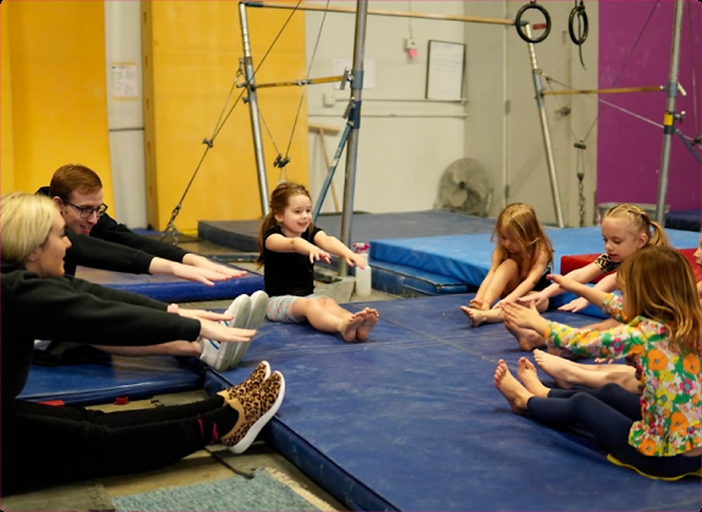 Children and families participating in an EvolveKids gym class